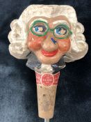 A Kinki-Bee Character bottle stopper and pourer in the form of an old lady