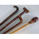 Four hard wood walking canes