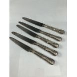 Five large Silver hallmarked Kings Pattern knives London Hallmarked 1888 maker 'SH', blades marked