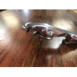 A vintage chrome Jaguar car mascot, 19cm long.