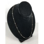 18ct White Gold fine trace-link Necklace chain, approx: 23” long and set with 20 approx: 0.05ct