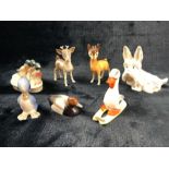 Collection of seven Beswick comical animals to include skiing duck, fawns, dog, etc