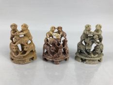 Three carved soapstone monkey figures in pyramids along with two crane soapstone figures.