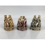 Three carved soapstone monkey figures in pyramids along with two crane soapstone figures.