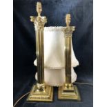 Two brass pillar lamps with silk shades