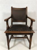 substantial carver chair with studded leather seat and backrest