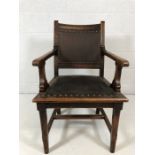 substantial carver chair with studded leather seat and backrest