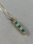 9ct Gold pendant set with Diamonds and Green square cut Emeralds on 9ct fine necklace