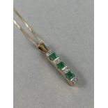 9ct Gold pendant set with Diamonds and Green square cut Emeralds on 9ct fine necklace