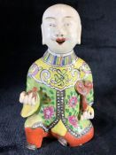 Chinese hand-painted porcelain figure, possibly a whistle or wind instrument, approx 18cm in