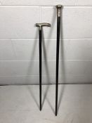 Two ebony silver-topped walking canes, hallmarked Birmingham and London, one dated 1894, the other