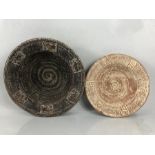 Two Large terracotta Pottery chargers. One with impressed 'Elephant' design to rim.