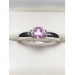 9ct White Gold ring set with Pink Sapphire and with two Diamonds to each shoulder (size 'L')