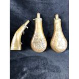 Three powder flasks, two brass and copper, the other horn and brass