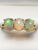 9ct Gold ring set with three Ethiopian Opals each on four claws (size 'Q')