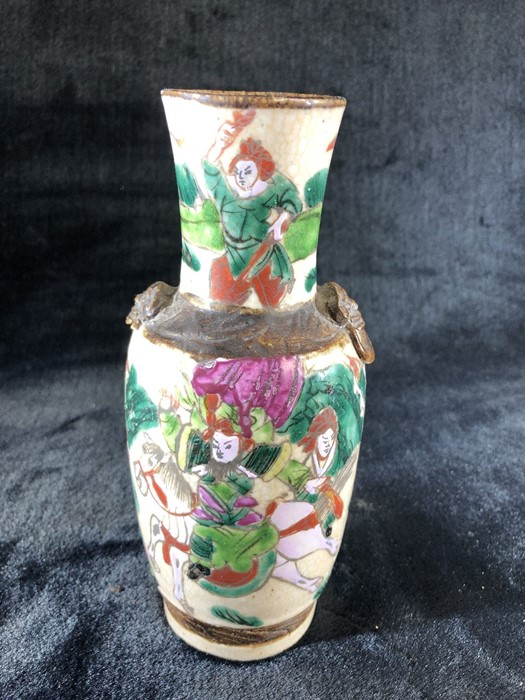 Small Chinese vase (A/F) crackle glaze Brown etched mark to base depicting warriors on horse back