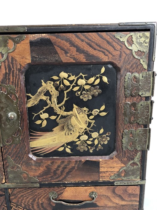 A Japanese Teisho period (1912-26) lacquered and specimen wood table cabinet, the interior with - Image 3 of 17