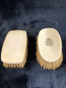 Pair of Bone backed brushes, one oval one square, the Oval brush bearing a monogram the square brush