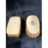 Pair of Bone backed brushes, one oval one square, the Oval brush bearing a monogram the square brush