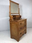 Satin wood chest of three drawers with brass handles and mirror and drawer over