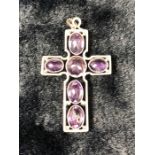 Unmarked Silver Amethyst Cross, set with One round stone and 5 Oval stones. Measuring approx:
