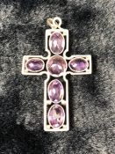 Unmarked Silver Amethyst Cross, set with One round stone and 5 Oval stones. Measuring approx: