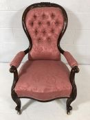 Victorian nursing chair on original casters with pink button back upholstery