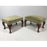 Pair of matching green upholstered foot stools on queen Anne legs