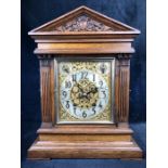 A Winterhalder & Hofmeier striking eight day mantel clock with silvered silent / chime, slow /