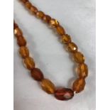 String of faceted Amber Coloured beads