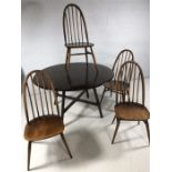 Ercol Dining table and four Stick back chairs
