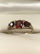 9ct 375 Hallmarked Gold three stone Garnet ring size M.5