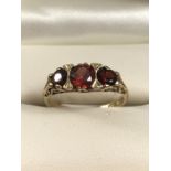 9ct 375 Hallmarked Gold three stone Garnet ring size M.5