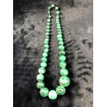 Measuring approx: 26” long (No Clasp) A Graduated string of Malachite Beads from 9.7mm to 22.4mm