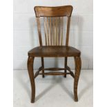 Single oak chair with spindle back and saddle seat