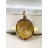 Oval faceted Citrine in 9ct Gold mount