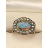 Georgian Mourning Ring set with an oval Black Opal measuring approx: 5.5mm x 10.3 across. Surrounded