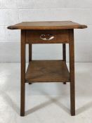 Arts and crafts style oak occasional table with serpentine top tier