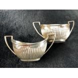 Pair of twin handled Silver Birmingham hallmarked salts 1905 by William E Turner (approx 55g)