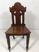 Single carved ecclesiastical chair with turned front legs