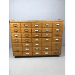 Haberdashery unit with thirty five pine matching drawers approx 44cm x 22cm x 9.5cm each, with metal