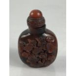 Chinese Cinnabar Snuff bottle depicting fish on either side and with an eight figure character mark