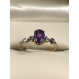 9ct hallmarked 375 Gold ring set with Oval cut Amethyst with Diamonds to shoulders size M.5