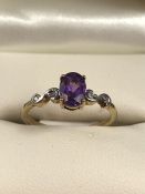 9ct hallmarked 375 Gold ring set with Oval cut Amethyst with Diamonds to shoulders size M.5