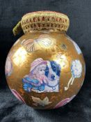 Oversized Victorian Christmas bauble decorated with traditional 'cut-outs'