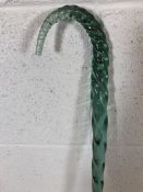 A possibly late 19th Century barley twist glass crook in green, approx 132cm in height A/F