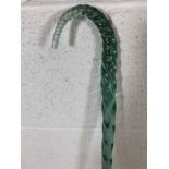 A possibly late 19th Century barley twist glass crook in green, approx 132cm in height A/F