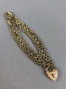 9ct Gold Bracelet marked 375 with heart shaped lock approx 7.1g