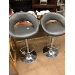 Pair of Grey upholstered bar stools (hydraulic)