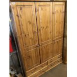 Triple pine wardrobe with four drawers under